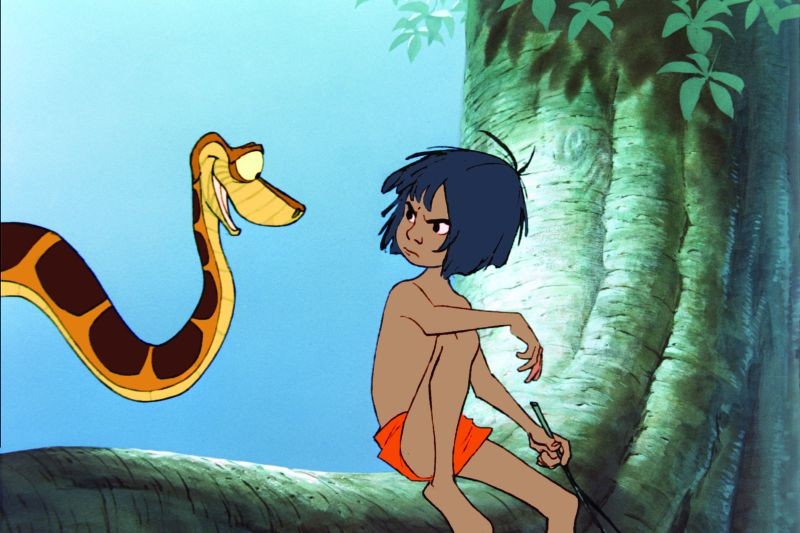 Il Libro Della Giungla Mowgli Insieme Al Pitone Delle Rocce Kaa In Una Scena 277543 