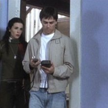 Laura Mennell e Paul Dzenkiw in una scena di 11:11 - La paura ha un nuovo numero