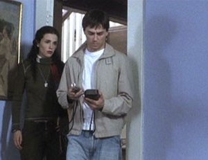 Laura Mennell e Paul Dzenkiw in una scena di 11:11 - La paura ha un nuovo numero