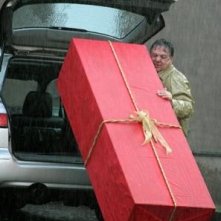 Renato Pozzetto in una scena del film Un amore su misura