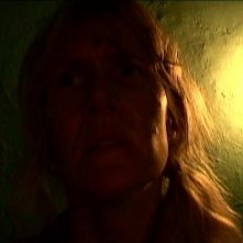 Una suggestiva immagine di Laura Dern in una scena di INLAND EMPIRE