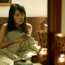 Yu Nan in una scena di In Love We Trust