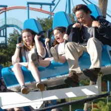 Shélan O'Keefe, Gracie Bednarczyk e John Cusack in una scena del film Grace is Gone