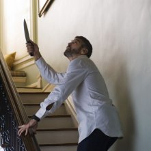 George Clooney in una scena del film Burn After Reading