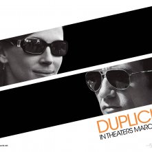 Un wallpaper del film Duplicity con Julia Roberts e Clive Owen