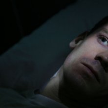 Un primo piano di Henry Garrett, protagonista del film Visions diretto da Luigi Cecinelli