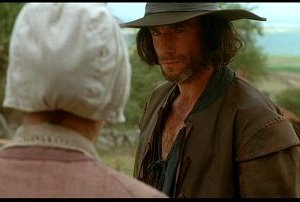 Daniel Day-Lewis e Winona Ryder in una scena del film La seduzione del male