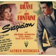 Cary Grant e Joan Fontaine in una lobbycard a colori del film Il sospetto