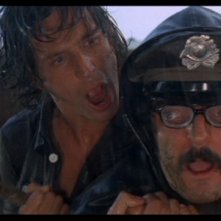 Michael Brandon in una scena del film Quattro mosche di velluto grigio (1971)