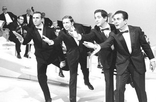 Quattro icone della tv italiana: Mike Bongiorno, Corrado, Pippo Baudo ed Enzo Tortora.
