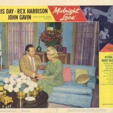 Rex Harrison e Doris Day in una lobby card promozionale del film Merletto di mezzanotte ( 1960 )