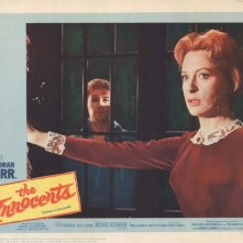 Deborah Kerr e Peter Wyngarde in una lobby card promozionale del film Suspense ( 1961 )