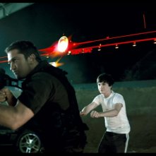 Gerard Butler e Logan Lerman in una scena del film Gamer