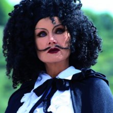 Barbara Bouchet nei panni della Donna coi baffi nel film Butterfly Zone - Il senso della farfalla