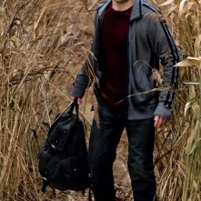 Daniel Radcliffe in un campo nel film Harry Potter e i Doni della Morte - parte 1