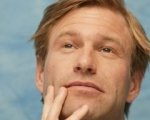 Aaron Eckhart espatria