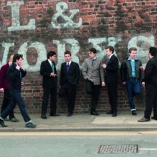 John Lennon (Aaron Johnson) con alcuni musicisti nel film Nowhere Boy