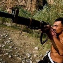 Liao Fan nell'action Let the Bullets Fly