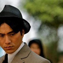 Primo piano di Chen Kun dal film Let the Bullets Fly