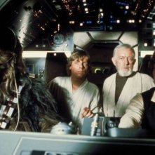 Peter Mayhew, Alec Guinness, Mark Hamill e Harrison Ford in Guerre Stellari