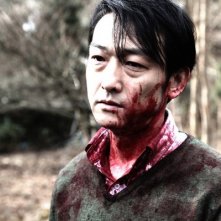 Primo piano di Mitsuru Fukikoshi, tormentato protagonista di Cold Fish di Sono Sion