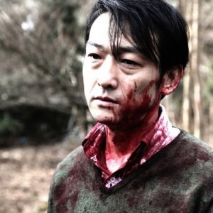 Primo piano di Mitsuru Fukikoshi, tormentato protagonista di Cold Fish di Sono Sion