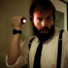 Insidious: Angus Sampson in una scena dell'horror diretto da James Wan