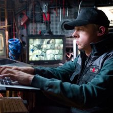 Simon Pegg alle prese con i suoi computer in una scena di Mission: Impossible - Protocollo Fantasma