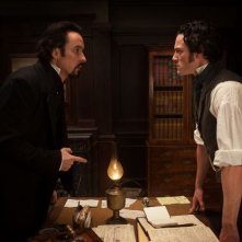 John Cusack insieme a Luke Evans in una scena del film The Raven