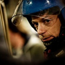 Filippo Nigro in tenuta antisommossa in una scena del film A.C.A.B.