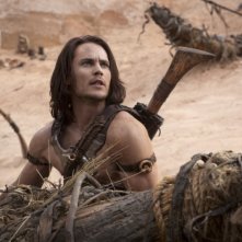 Taylor Kitsch in azione in una scena dell'avventuroso John Carter