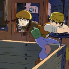 Pazu e Sheeta sul trenino della miniera in una scena del film Il castello nel cielo