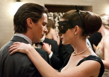 Christian Bale and Anne Hathaway dance together a scene from The Dark Knight Rises