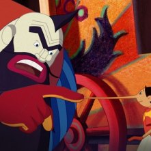 Pinocchio: Mangiafuoco e Pinocchio in una scena del film di Enzo d'Alò