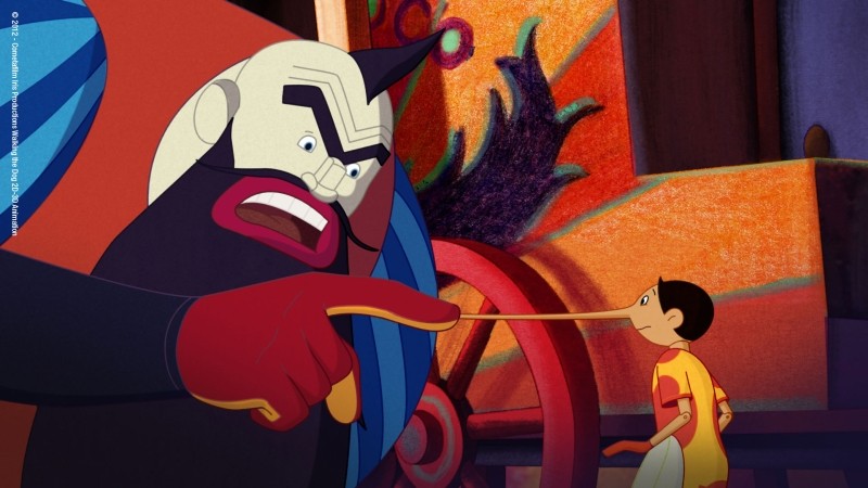 Pinocchio: Mangiafuoco e Pinocchio in una scena del film di Enzo d'Alò