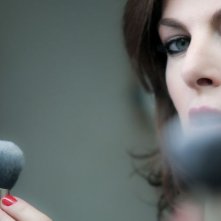 Una famiglia perfetta: lo sguardo sensuale di Claudia Gerini in una scena del film