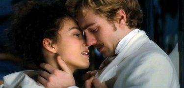 Keira Knightley kisses Aaron Johnson in a scene from Anna Karenina
