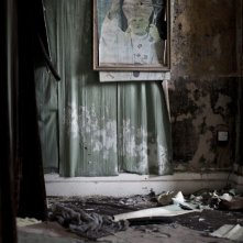 Mea maxima culpa. Silenzio nella casa di Dio: una foto di Giovanni Paolo II appesa nella chiesa di St. Joseph, nel nord di Belfast