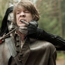 Famke Janssen minaccia Thomas Mann in una scena di Hansel & Gretel - Cacciatori di streghe