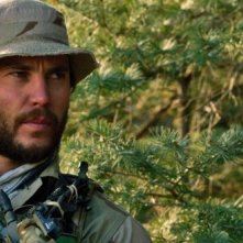 Lone Survivor: Taylor Kitsch in una scena del film sulla missione segreta del Navy Seals in Afghanistan
