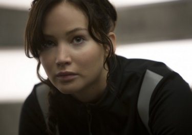 Hunger Games: la ragazza di fuoco, un primo piano di Jennifer Lawrence in allenamento