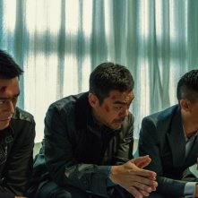 The White Storm: Louis Koo in una scena del film d'azione con Nick Cheung e Sean Lau