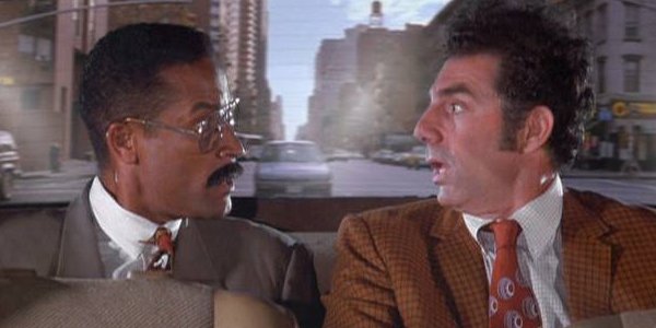 Michael Richards con Phil Morris in una sequenza in macchina di Seinfeld