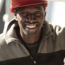 Samba: Omar Sy sorride in una scena del film