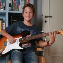 I bambini sanno: il bambino Vittorio Cerroni sorride in una scena