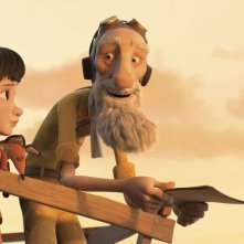 Il Piccolo Principe: l'aviatore e la bambina in una scena del film d'animazione