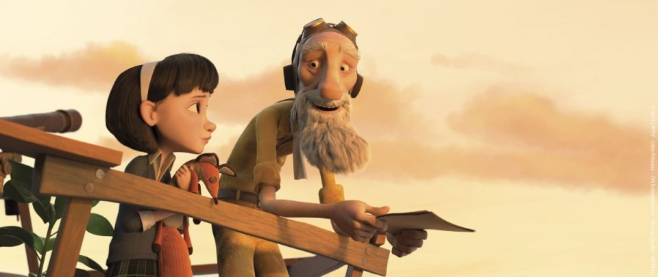Il Piccolo Principe: l'aviatore e la bambina in una scena del film d'animazione