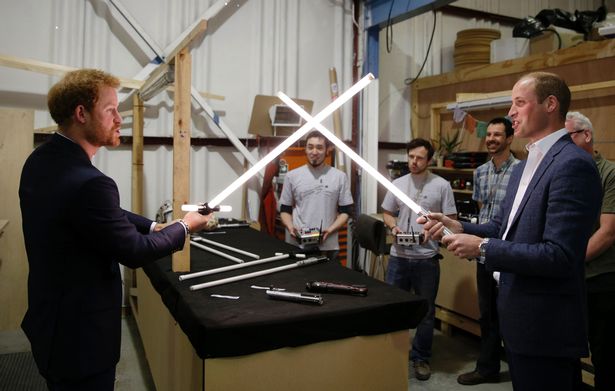 The Duke Of Cambridge Prince William R Tries A Light Sabre Against His Brother Prince Harry