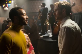 La La Land: John Legend, Ryan Gosling ed Emma Stone in un momento del film