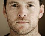 Manifesto: Sam Worthington affianca Paul Bettany nella serie su Unabomber